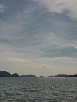 Seaside view with islands under cloudy sky in Japan 